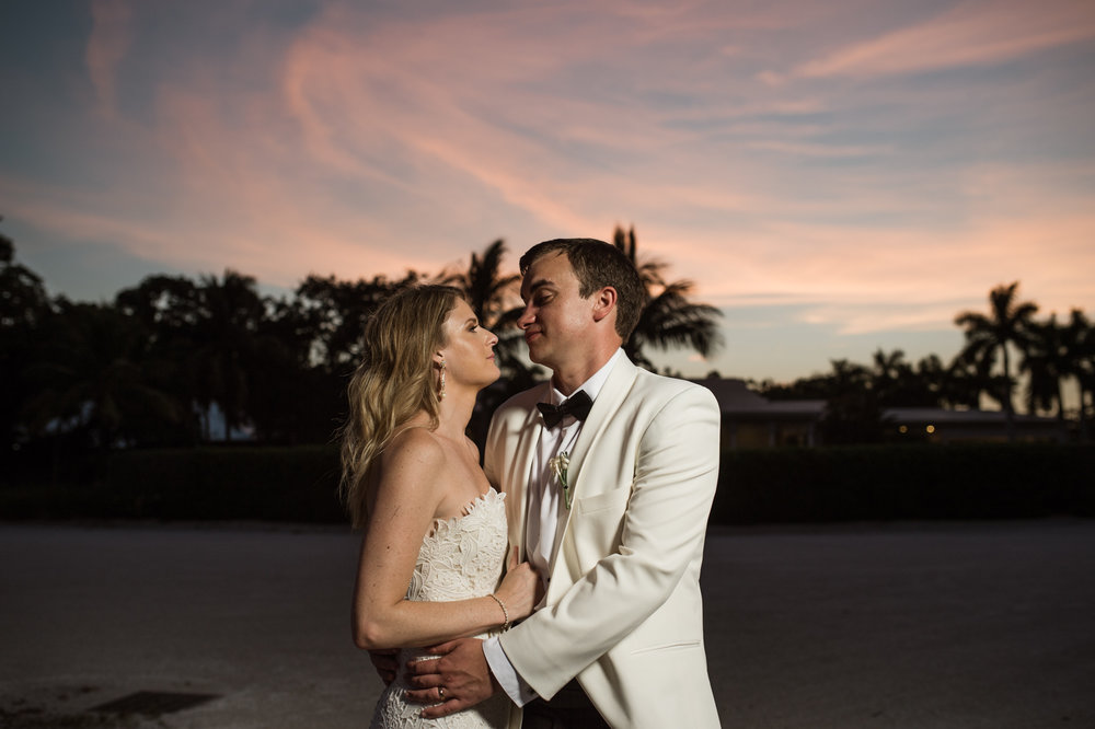 Dramatic Sunset Portrait of Bride and Groom at the Longboat Key Club in Sarasota, FL
