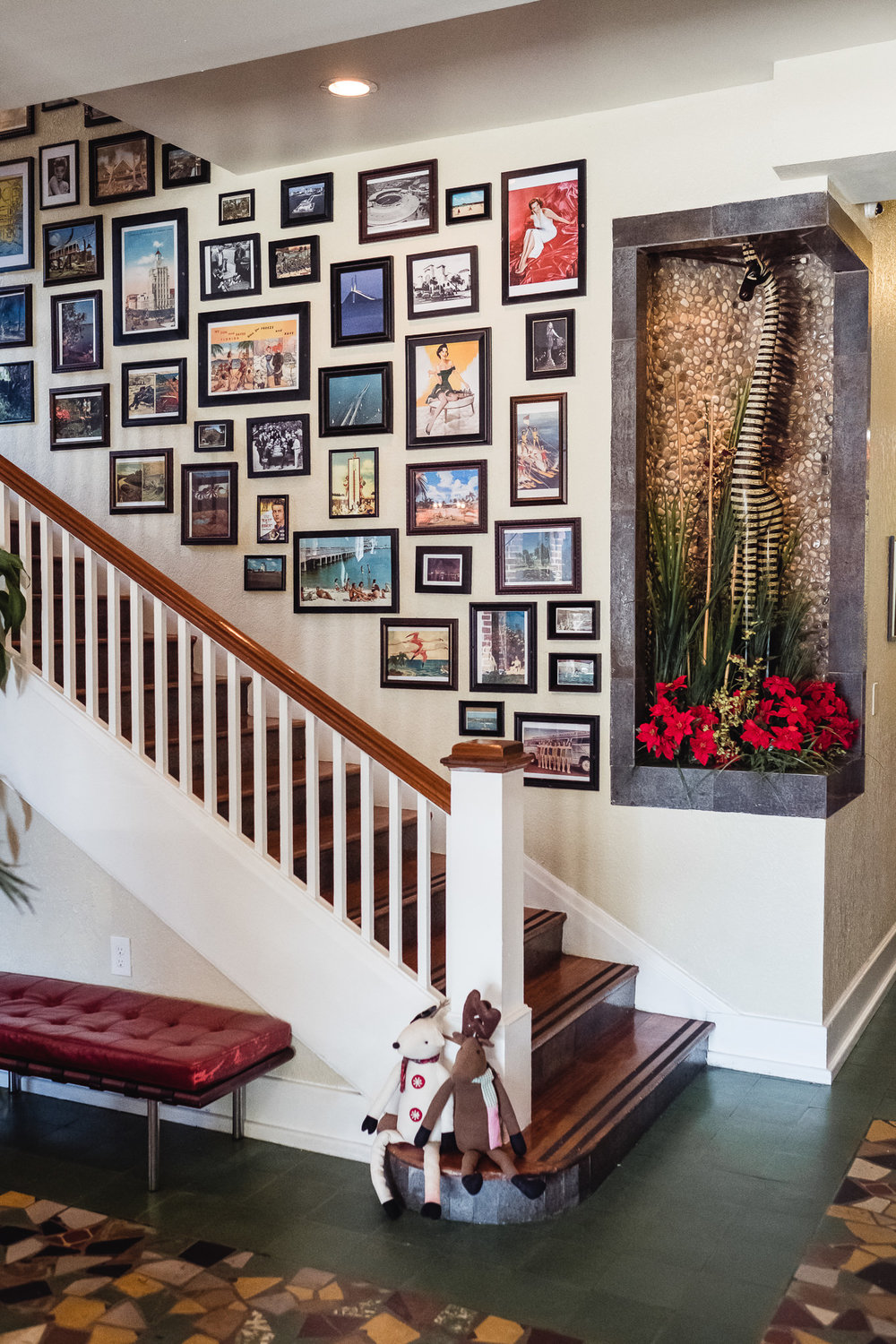 Collage of photographs lining the lobby staircase at the Hollander Hotel in St. Petersburg, Florida