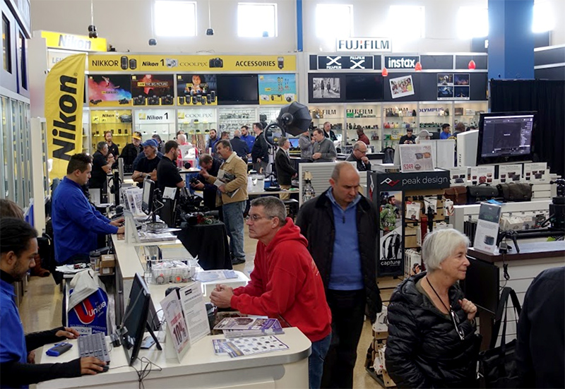A photo of me working the sales counter during a big expo style event in my earlier years at Unique Photo in Fairfield, New Jersey. I miss the people, but not the neon blue shirt.