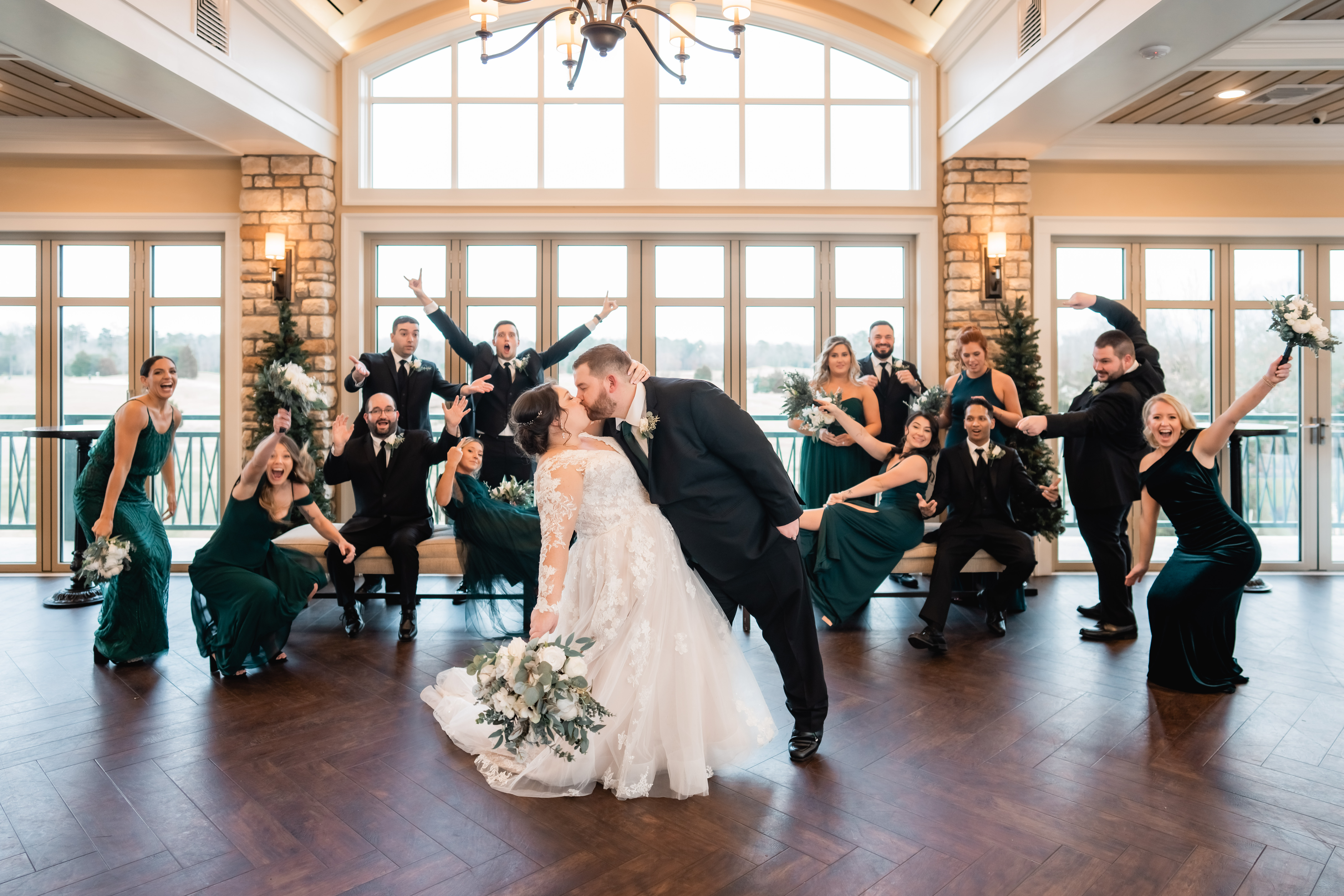Scotland Run Golf Club Wedding, Scotland Run Gold Club Wedding Photographer, Williamstown NJ Photographer, New Jersey Wedding Photographer, NJ Winter Wedding, bride and groom kissing while surrounded by their bridal party cheering and posing for their winter wedding 