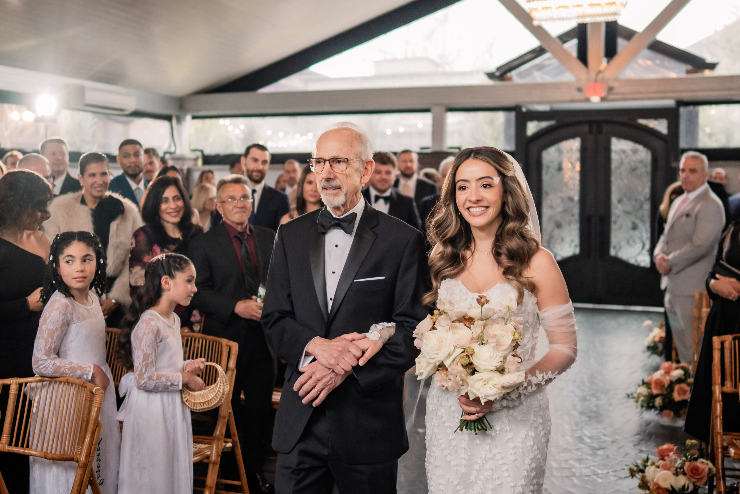 Park Loft wedding photography showing the bride walking down the aisle with her father inside the Belvedere ceremony space in Oceanport, NJ.