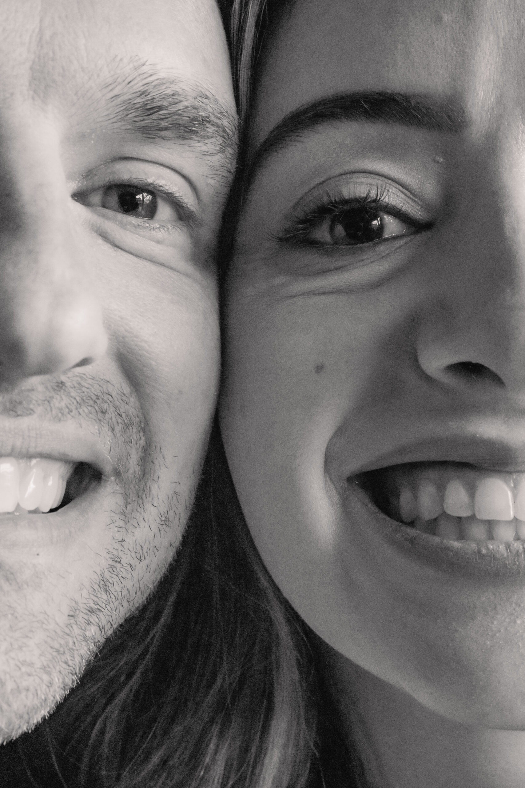 Playful black-and-white candid portrait of a newly married couple during their Park Loft wedding in Oceanport, New Jersey.