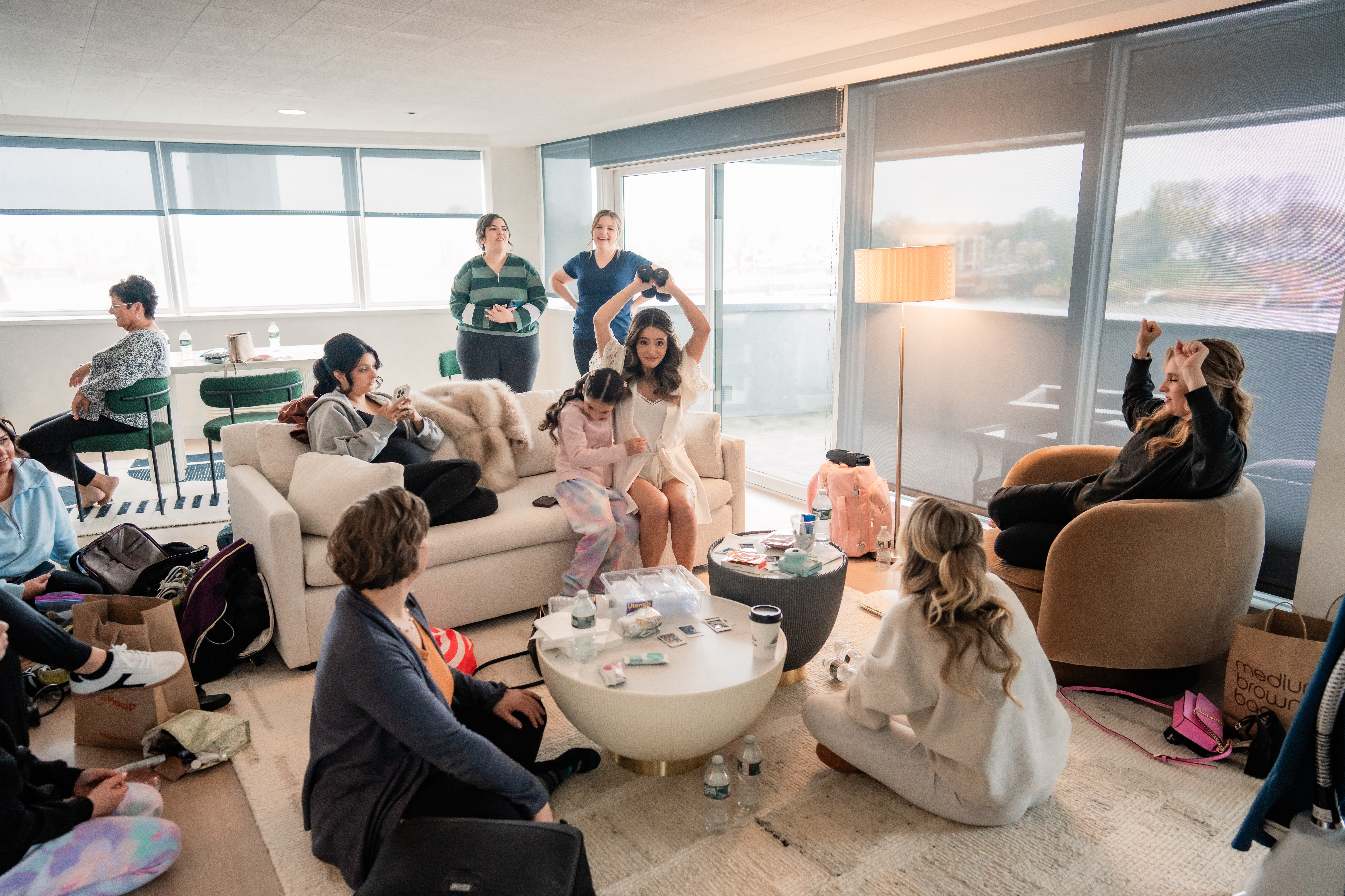 New Jersey wedding photography showing the bride getting ready with friends and family in a bright bridal suite before her Park Loft wedding.