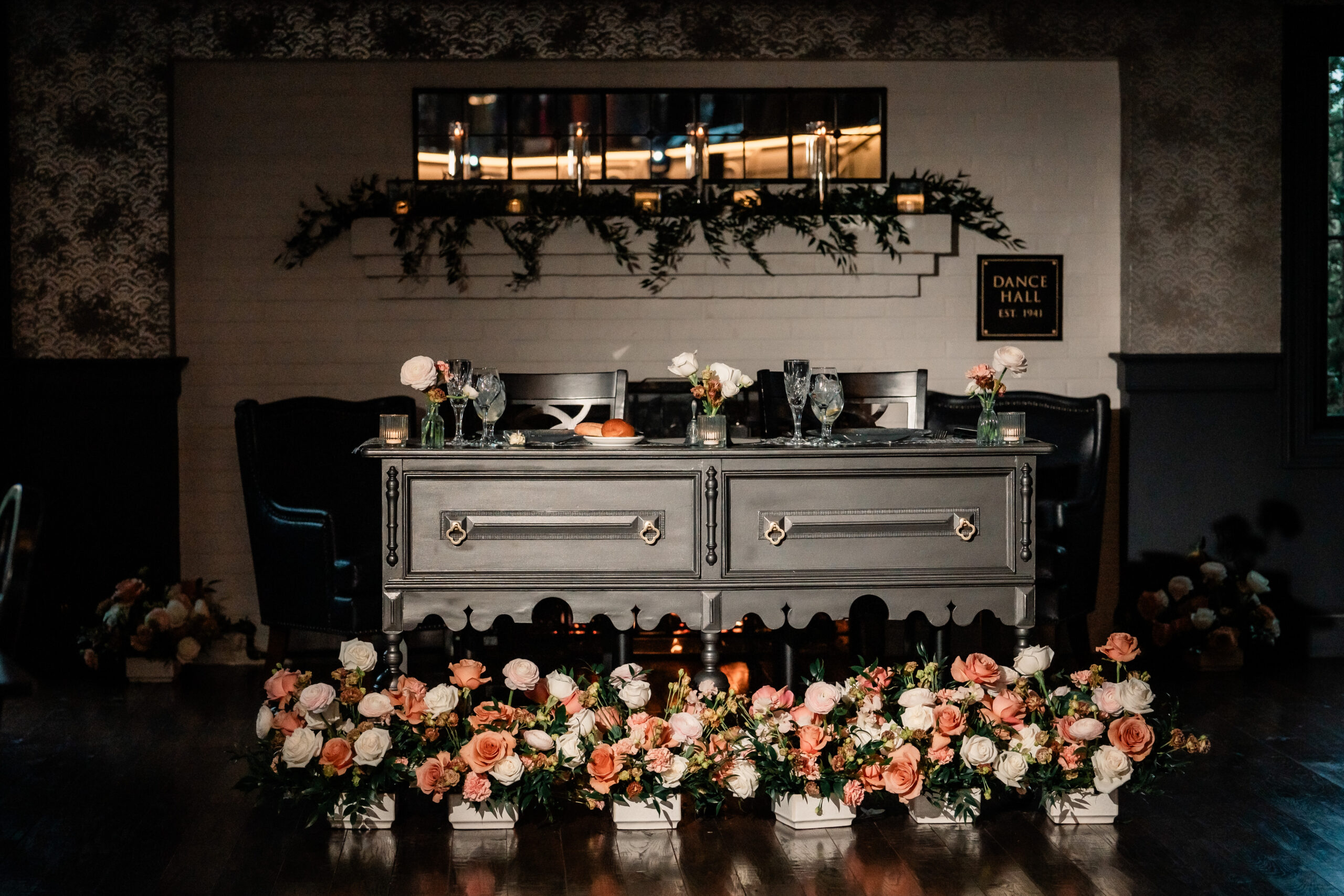 Park Loft wedding reception details featuring an elegant sweetheart table with white and blush florals inside the Oceanport, NJ venue.